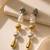 Dual tone metallic long drop earrings