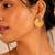 Gold plated metallic hoop earrings