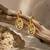 Gold plated metallic chunky drop earrings