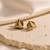 Gold plated metallic stud earrings
