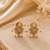 Gold plated metallic star stud earrings