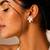 Silver metallic floral stud earrings