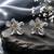 Silver metallic floral stud earrings