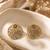 Gold plated metallic round stud earrings