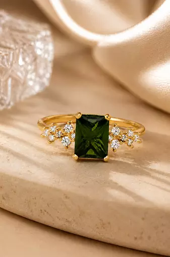 Gold plated green stone metallic ring
