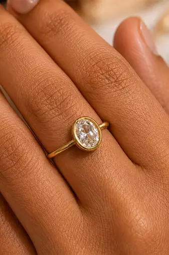 Gold plated oval stone metallic ring