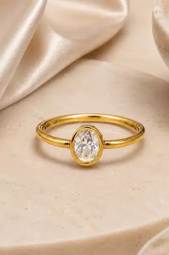 Gold plated oval stone metallic ring