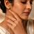Gold plated metallic round solitaire ring