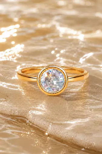 Gold plated metallic round solitaire ring