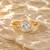 Gold plated metallic round solitaire ring