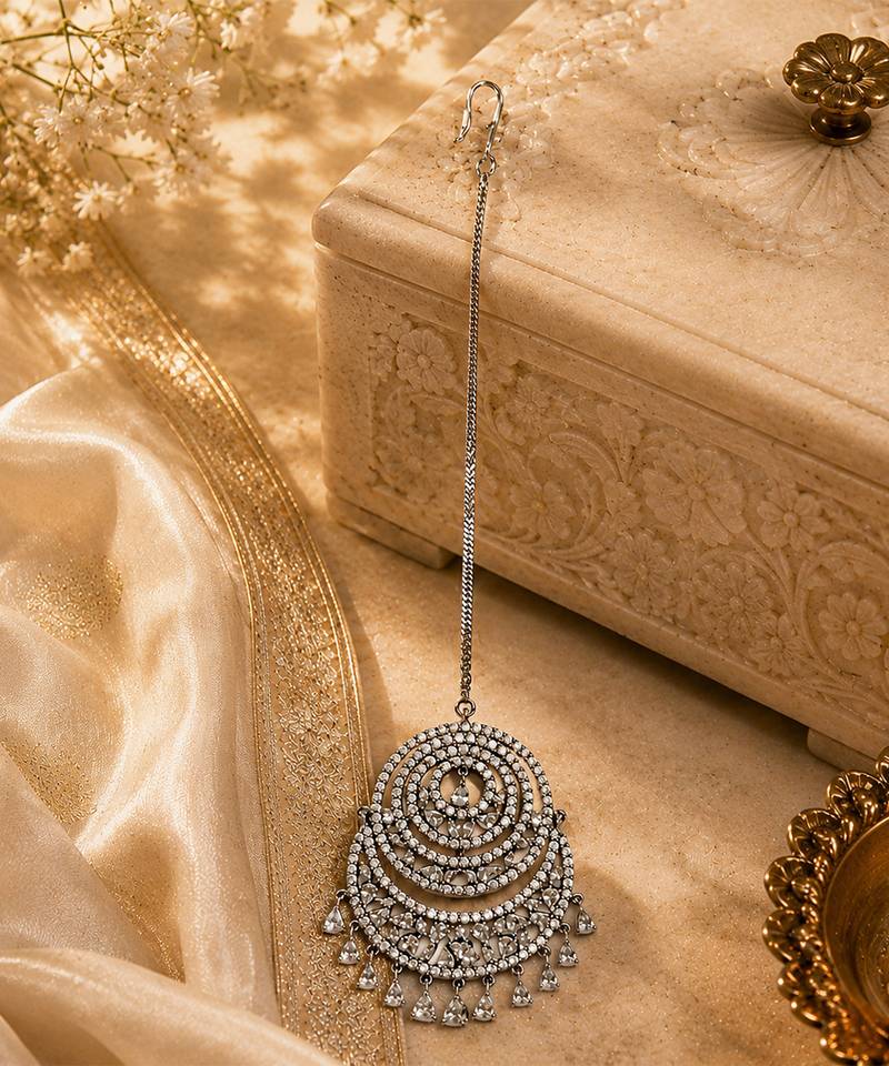 Silver crescent shaped metallic maang tikka