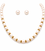 Pearl necklace set with gold-tone spacer rings, white oval freshwater pearls, round stud earrings included