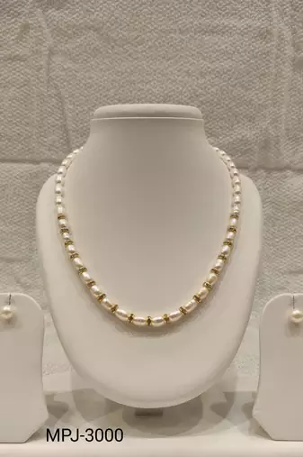 Pearl necklace set with gold-tone spacer rings, white oval freshwater pearls, round stud earrings included