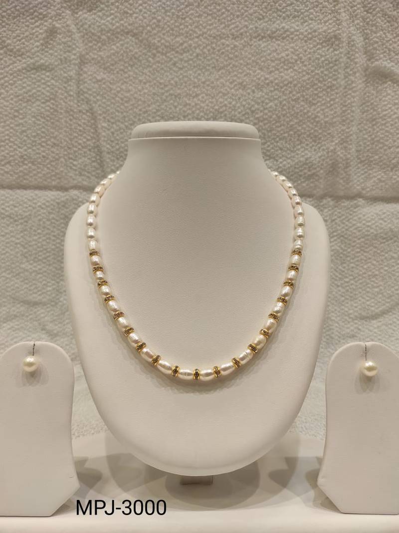 Pearl necklace set with gold-tone spacer rings, white oval freshwater pearls, round stud earrings included