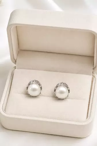 Pearl stud earrings, white freshwater pearl, silver-tone crown setting, classic elegant jewellery.