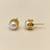 Pearl stud earrings, white freshwater pearl, gold-tone crown setting, classic elegant style.