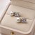 Pearl and square cubic zirconia stud earrings, silver tone, elegant bridal style
