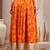 Orange floral printed cotton flared maxi skirt for women