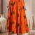 Orange graphic printed cotton flared maxi skirt for women