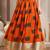 Orange graphic printed cotton flared maxi skirt for women