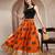 Orange graphic printed cotton flared maxi skirt for women