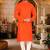 Dark orange cotton  kurta with pattern work and fancy button churidar