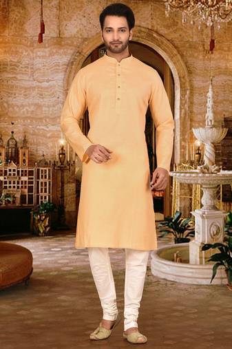 Beige cotton  kurta with pattern work and fancy button churidar