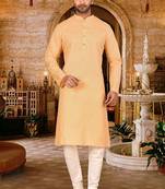 Beige cotton  kurta with pattern work and fancy button churidar