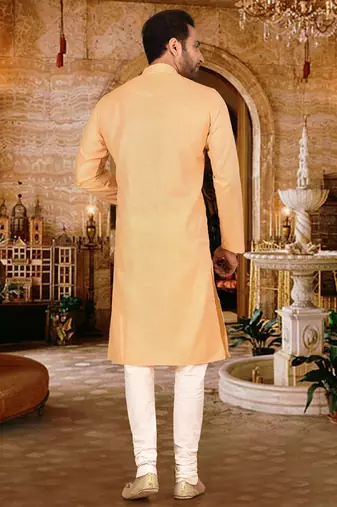 Beige cotton  kurta with pattern work and fancy button churidar