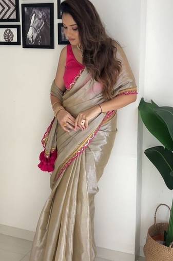 Beige tissue embroidered saree with sequins work
