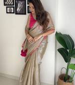 Beige tissue embroidered saree with sequins work