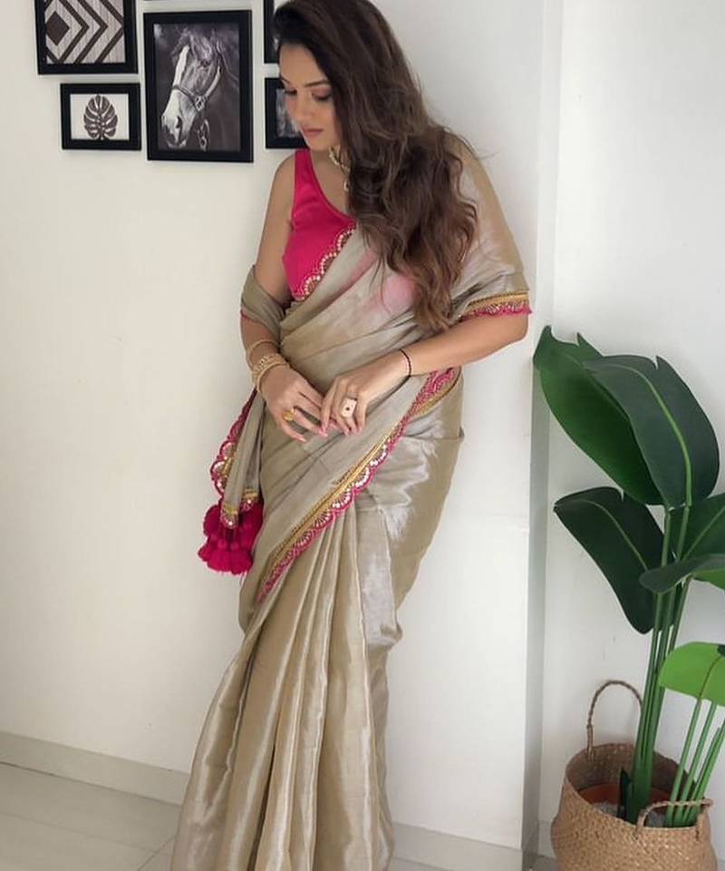 Beige tissue embroidered saree with sequins work