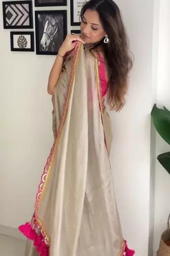 Beige tissue embroidered saree with sequins work