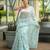 Sea green art silk printed saree with floral print