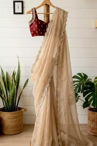 Beige silk blend embroidered saree with thread work