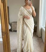 Cream satin embroidered saree with sequins work