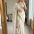 Cream satin embroidered saree with sequins work