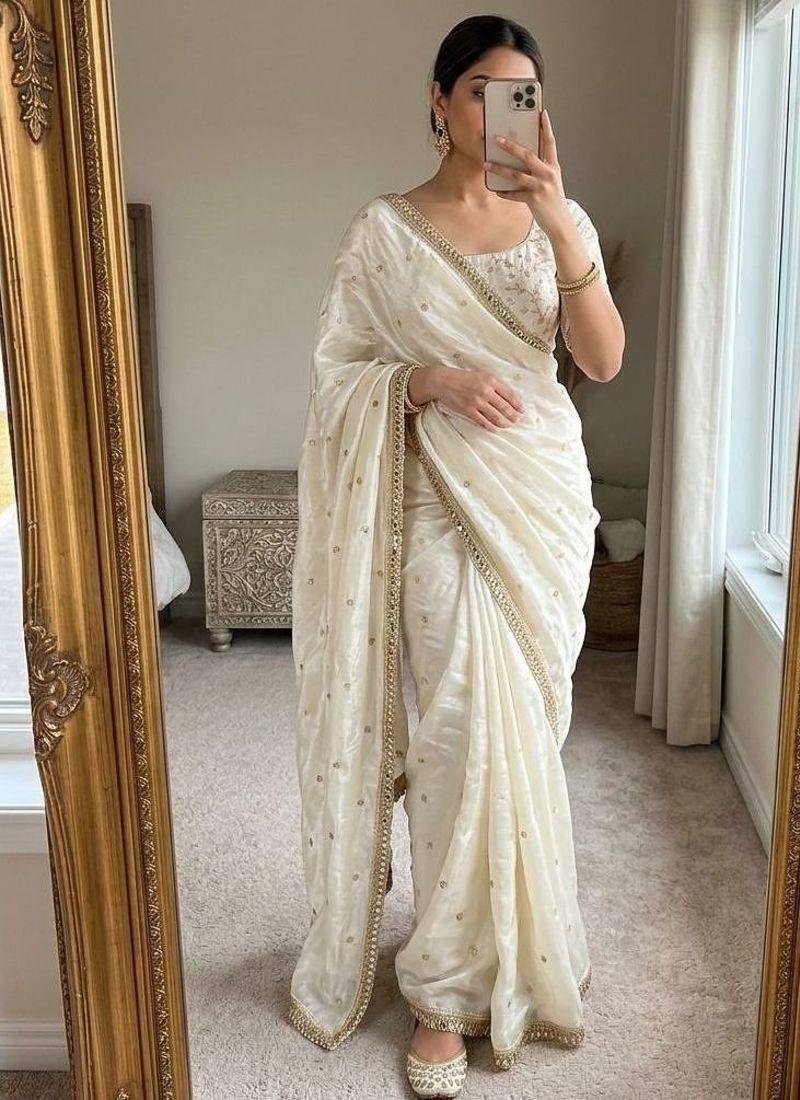 Cream satin embroidered saree with sequins work