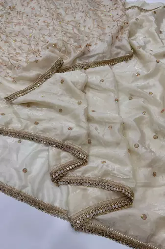Cream satin embroidered saree with sequins work