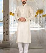 Off white dupion art silk  kurta with computerised embroidery machine work churidar