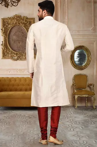 Cream dupion art silk  kurta with pattern work and 8 button churidar