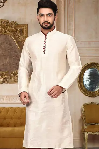 Cream dupion art silk  kurta with pattern work and 8 button churidar