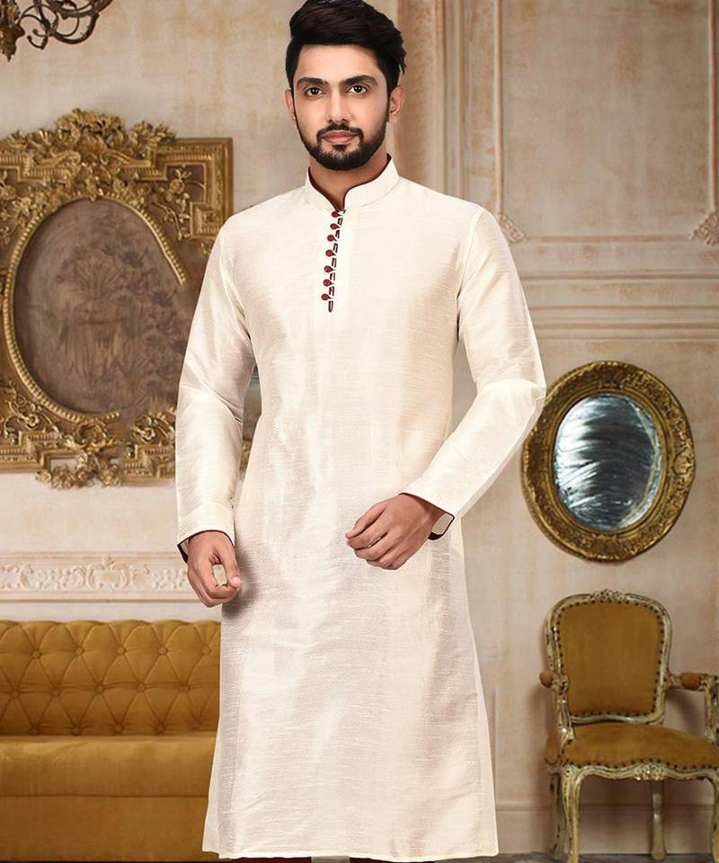 Cream dupion art silk  kurta with pattern work and 8 button churidar