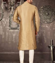 Beige dupion art silk  kurta with pattern work and 8 button churidar