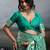 Sea green colour silk blend saree with rich gold zari work