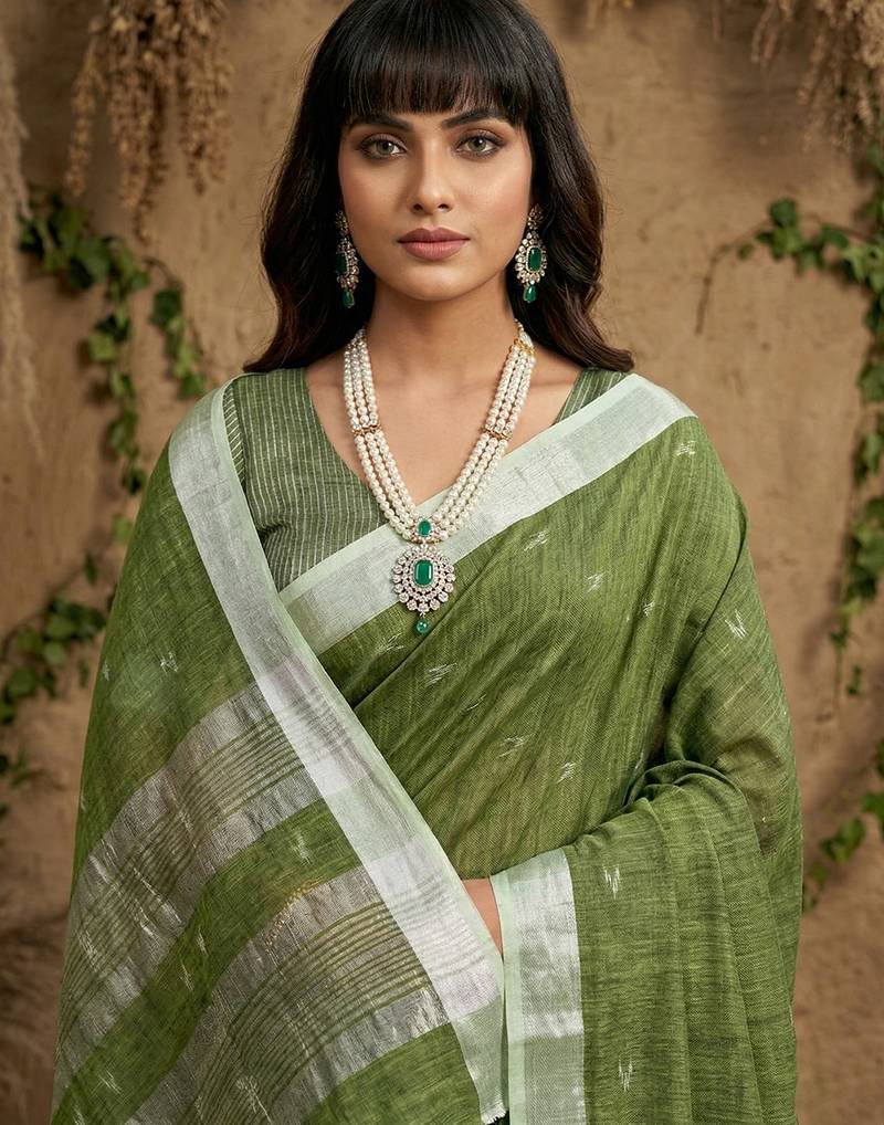 Green colour linen cotton saree with matching blouse piece