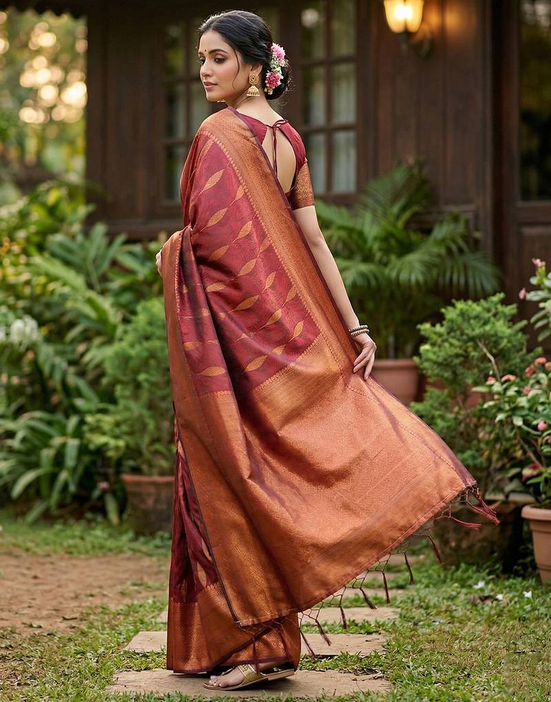Maroon colour silk blend woven saree with rich zari border and elegant tassels