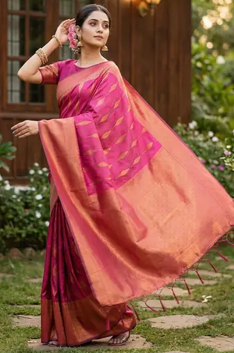 Light pink colour silk blend woven saree with rich zari border and elegant tassels
