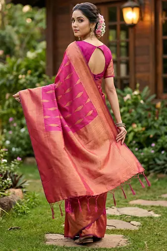 Light pink colour silk blend woven saree with rich zari border and elegant tassels