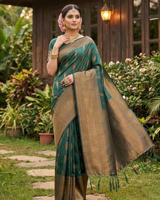 Green colour silk blend woven saree with rich zari border and elegant tassels 1